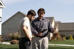 Lawn tech explaining treatment